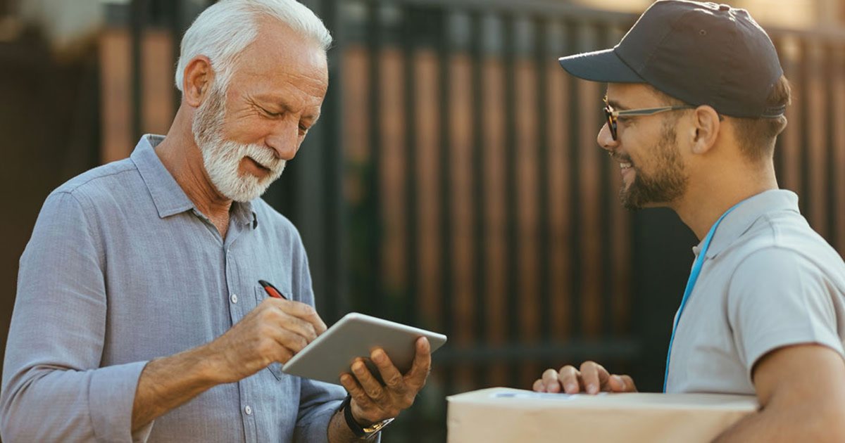 A customer signing for a parcel on a tablet
